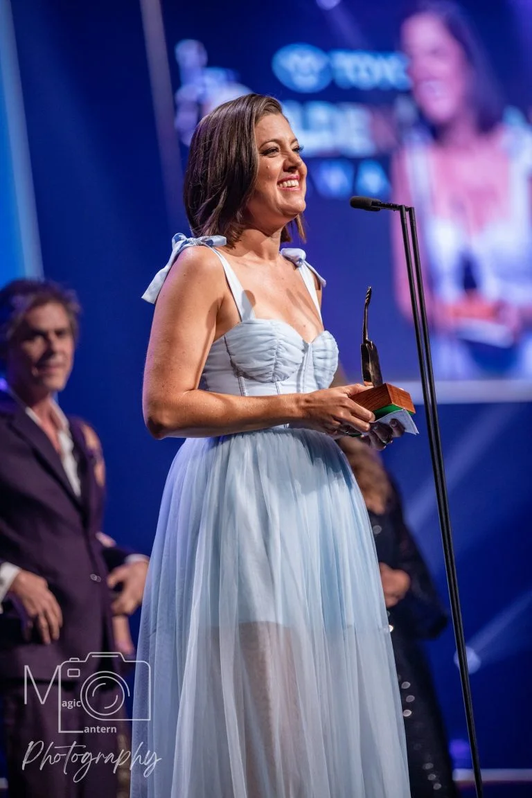 Amber Lawrence Country Singer holding Golden Guitar for Female Artist of the Year